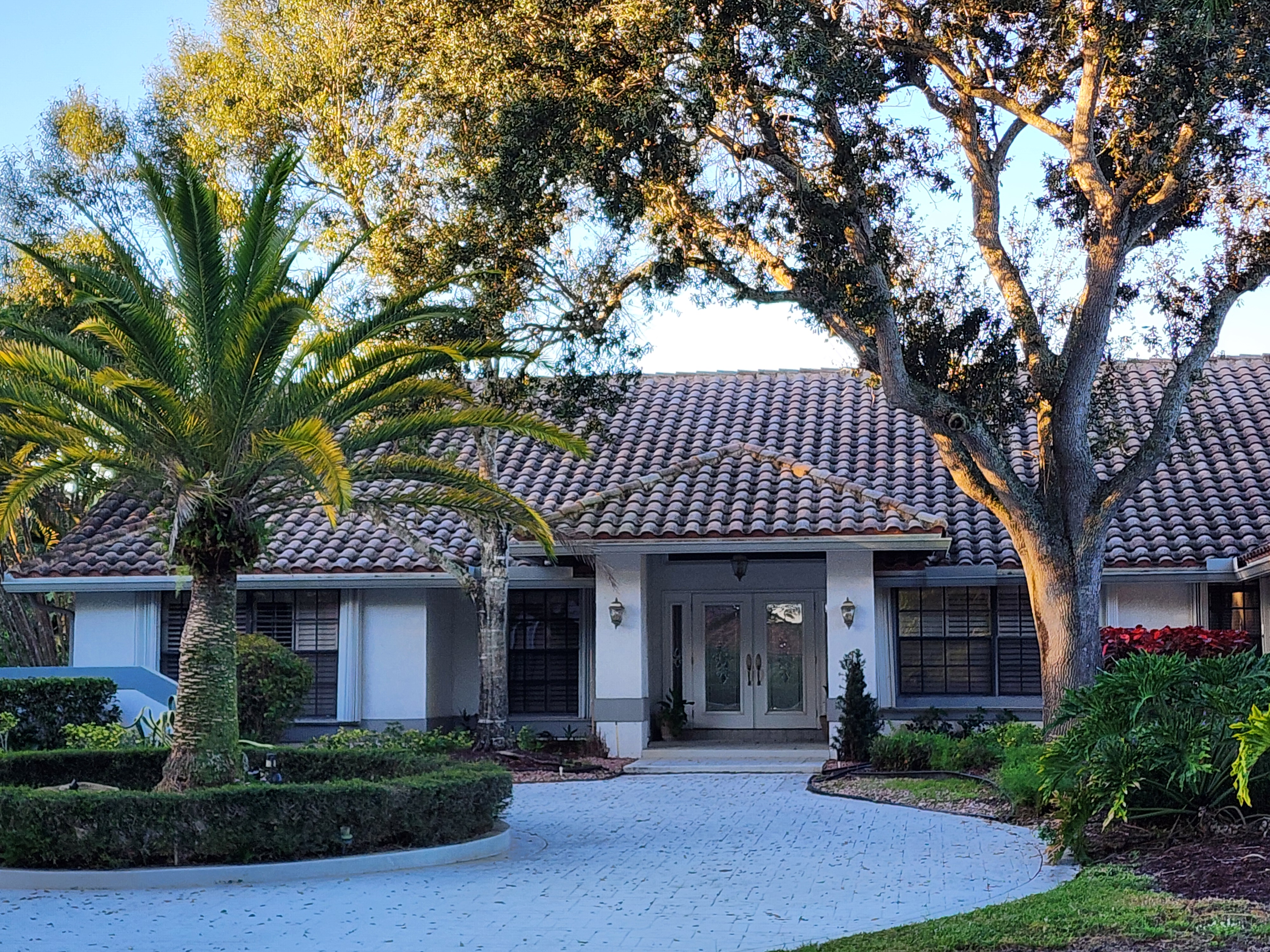 Roof in Boca Raton heavily covered with mold, algae, and dark stains before professional roof cleaning.