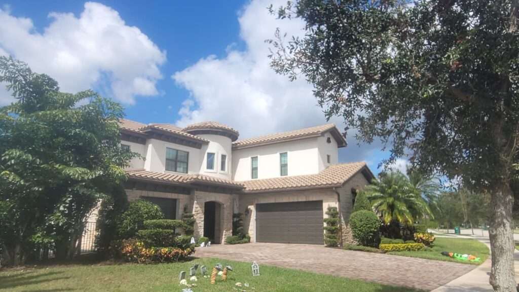Professional exterior house painting, completed by Excelsior Power Cleaning, in Boca Raton, Florida.