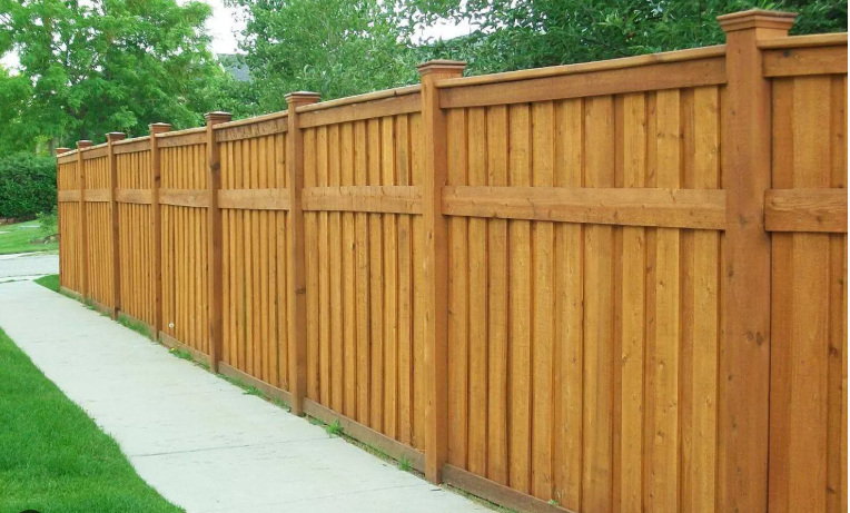 Restored wooden fence after expert pressure cleaning service in South Florida