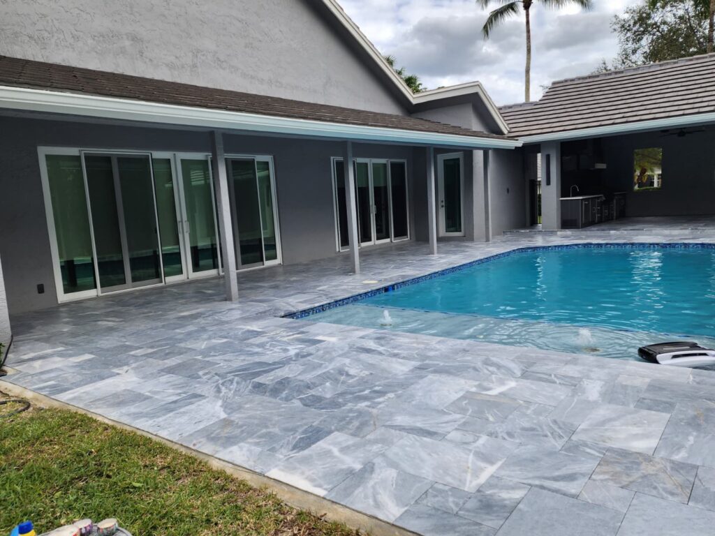Parkland pool deck and patio after professional pressure cleaning and sealing by Excelsior Power Cleaning