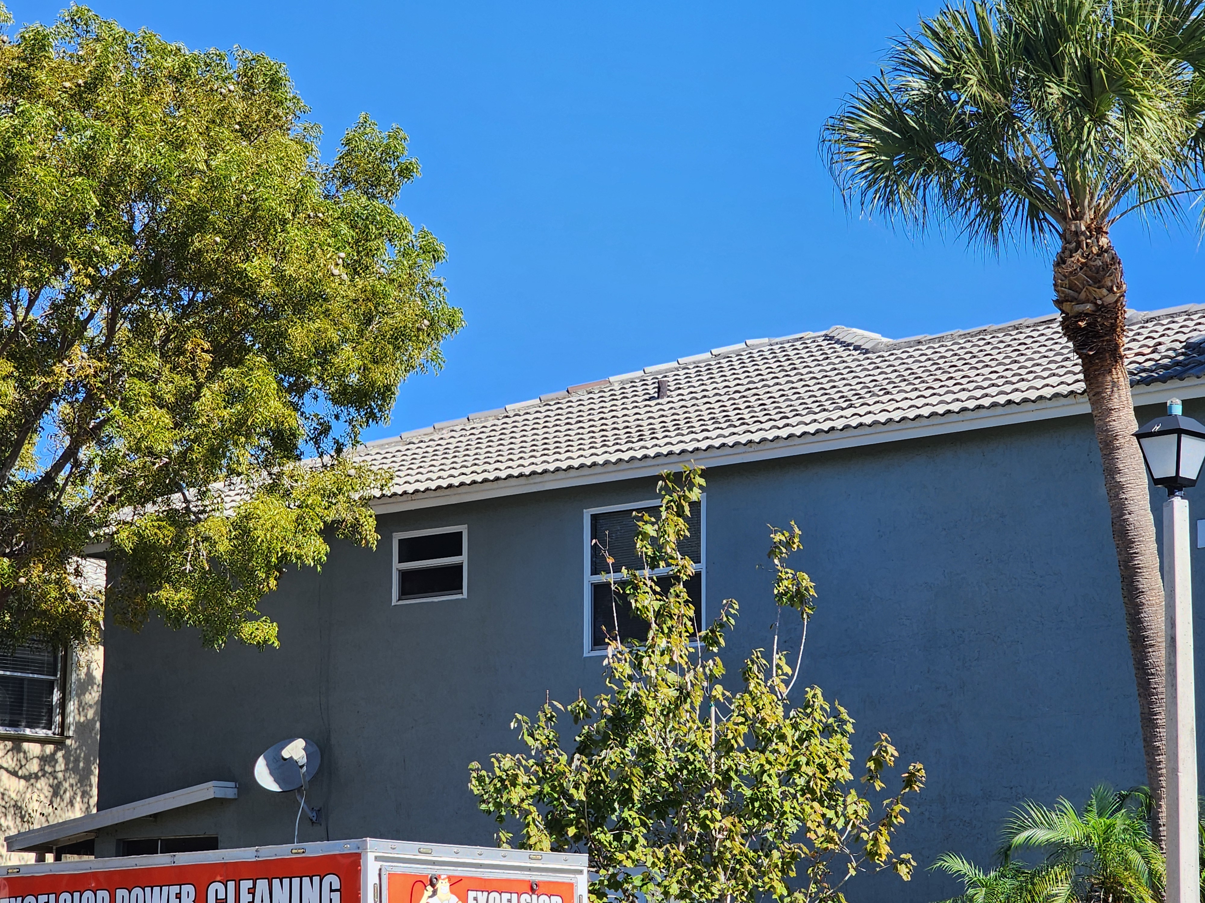Excelsior after roof pressure cleaning in Pompano Beach, FL, removing buildup and restoring a clean, well-maintained roof surface