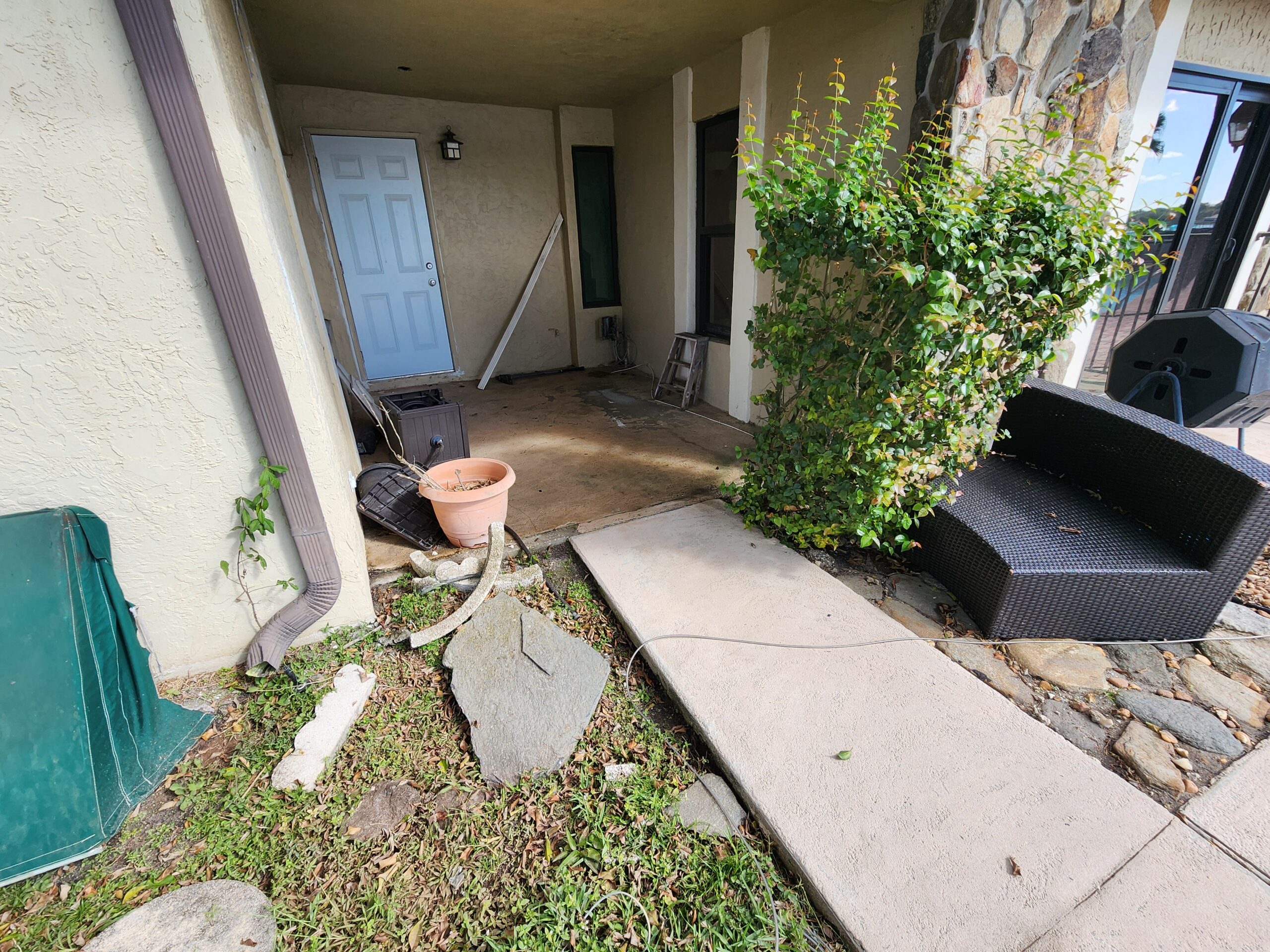 Exterior surfaces at Cascata at Mira Lago showing heavy dirt, mold, algae, and grime buildup before professional power washing