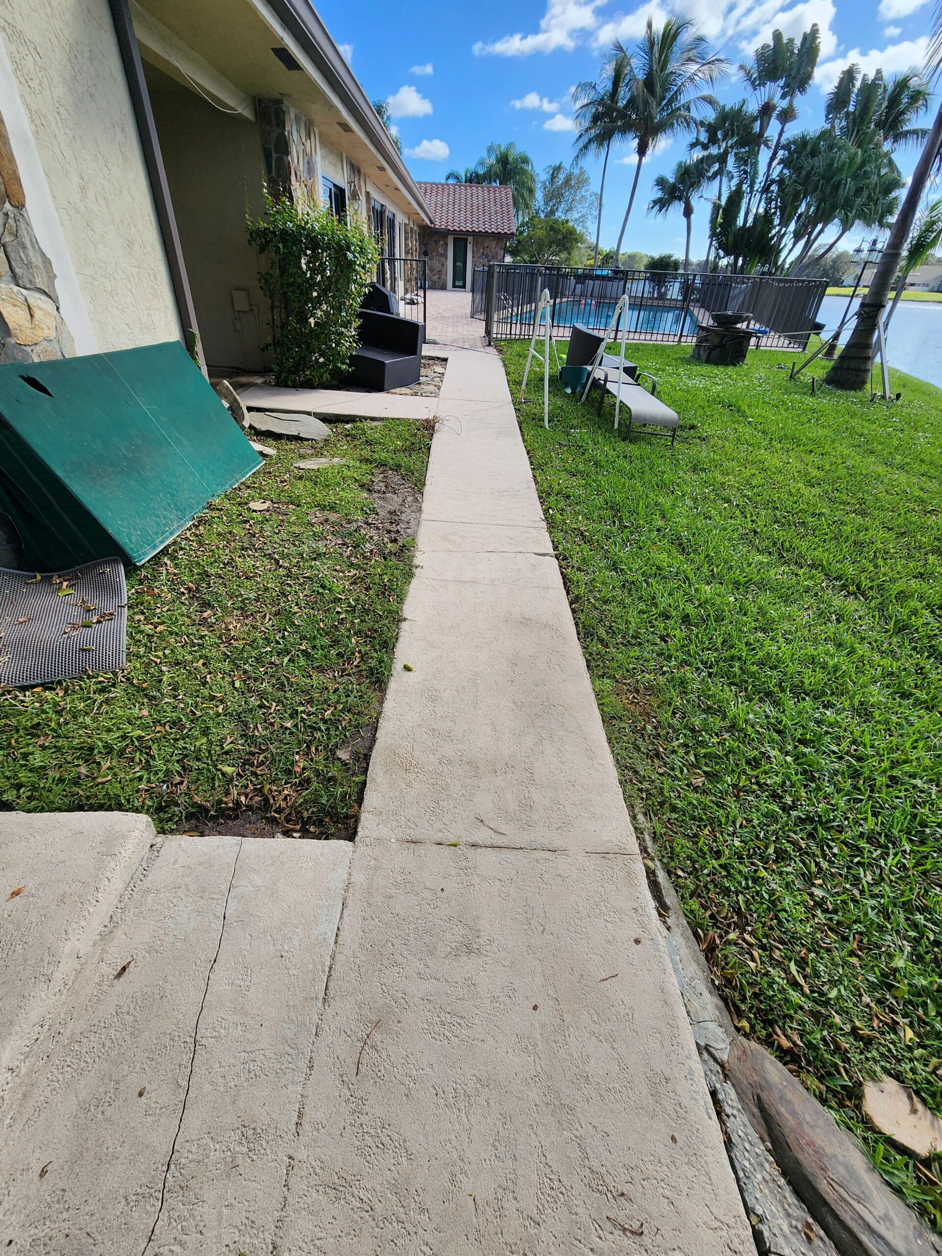 Exterior surfaces at Cascata at Mira Lago fully cleaned after professional power washing, with mold, algae, and grime removed for a fresh, bright appearance