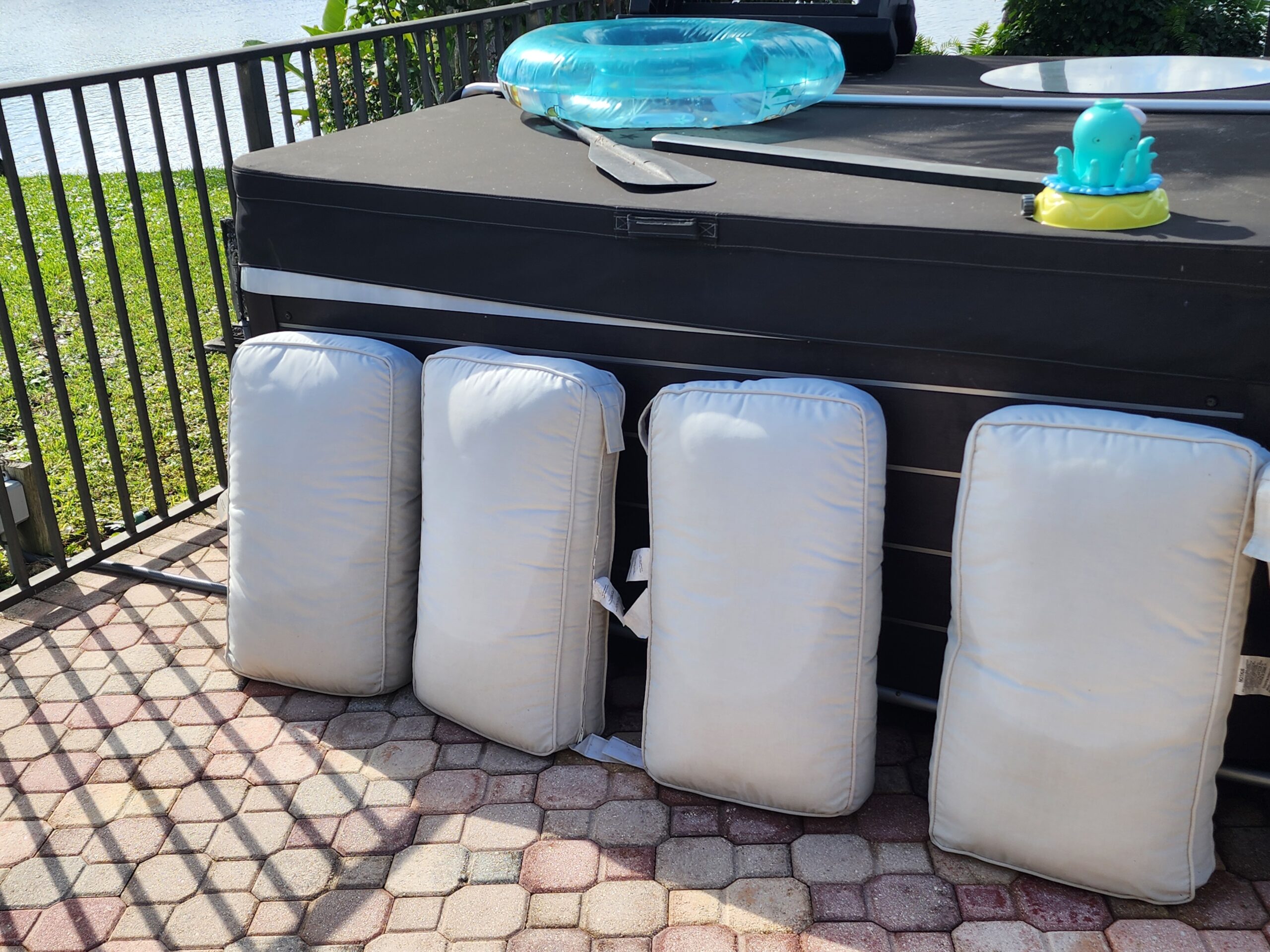Outdoor cushions after restoration, showing clean fabric with stains and mold fully removed