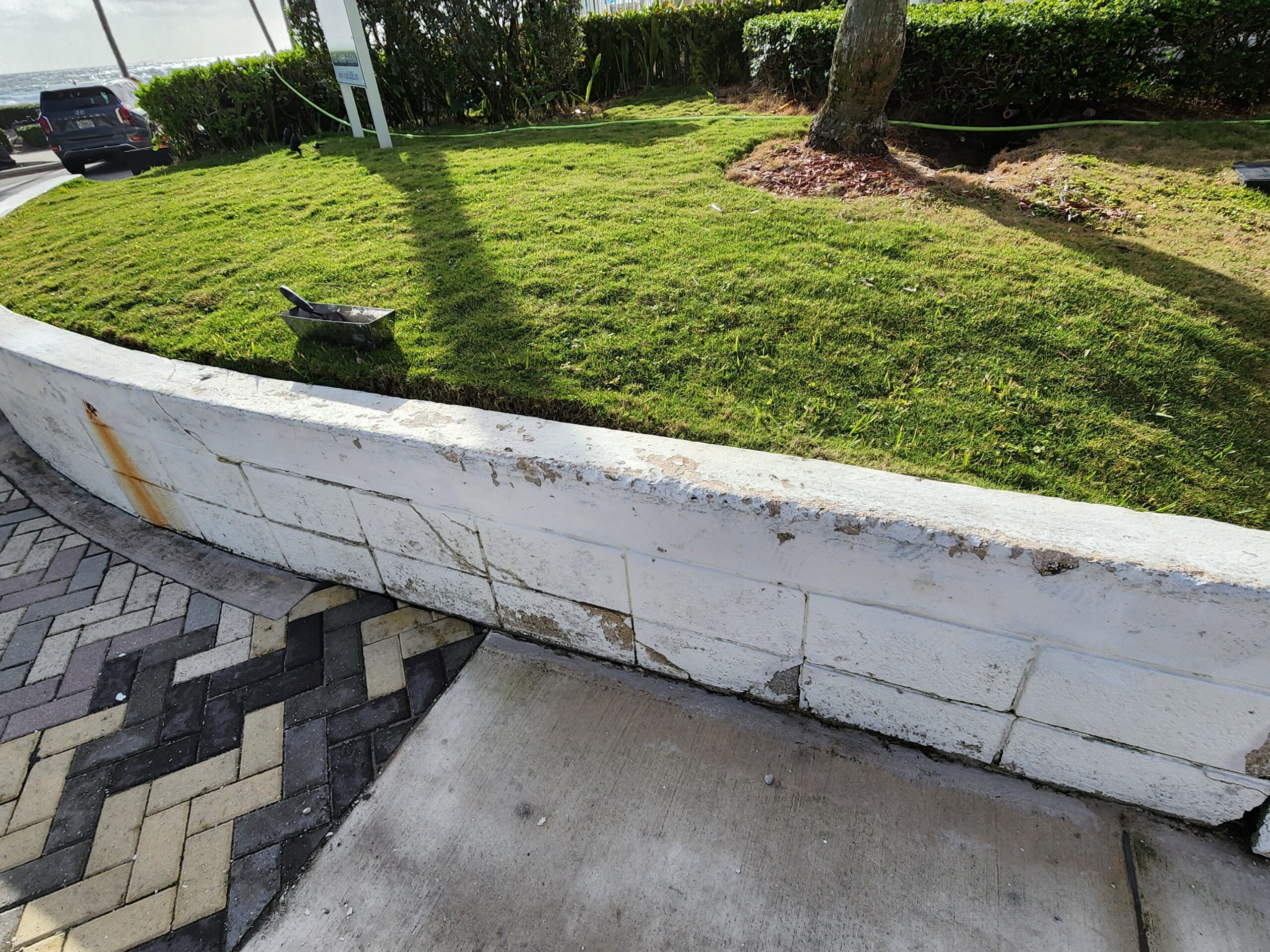 Exterior walls in Frenchman’s Creek FL showing cracks, peeling paint, stains, and surface deterioration before repair, cleaning, and professional painting