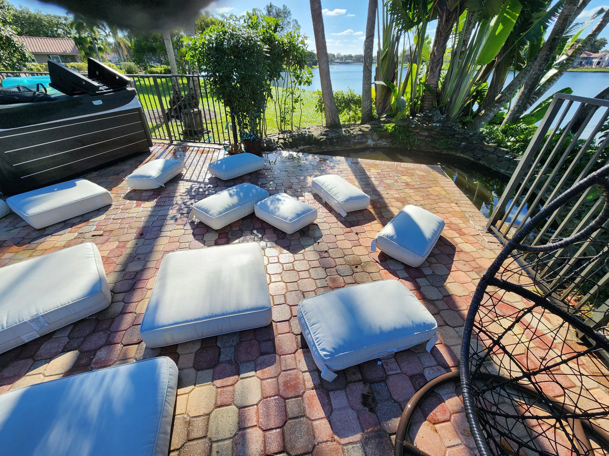 Outdoor cushions in Mirasol FL fully restored after professional cleaning, stains, mold, and mildew removed, bright and refreshed appearance