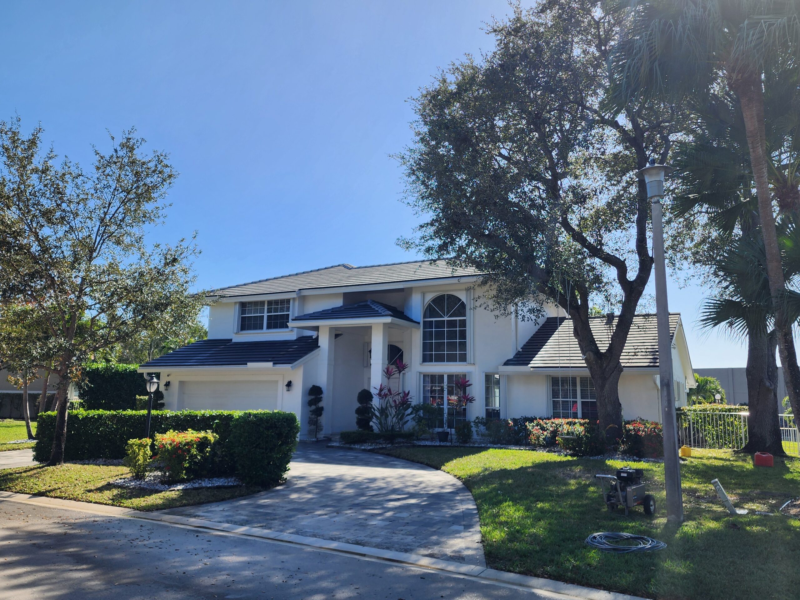 Driveway pressure cleaning in Boca Raton by Excelsior after professional surface restoration