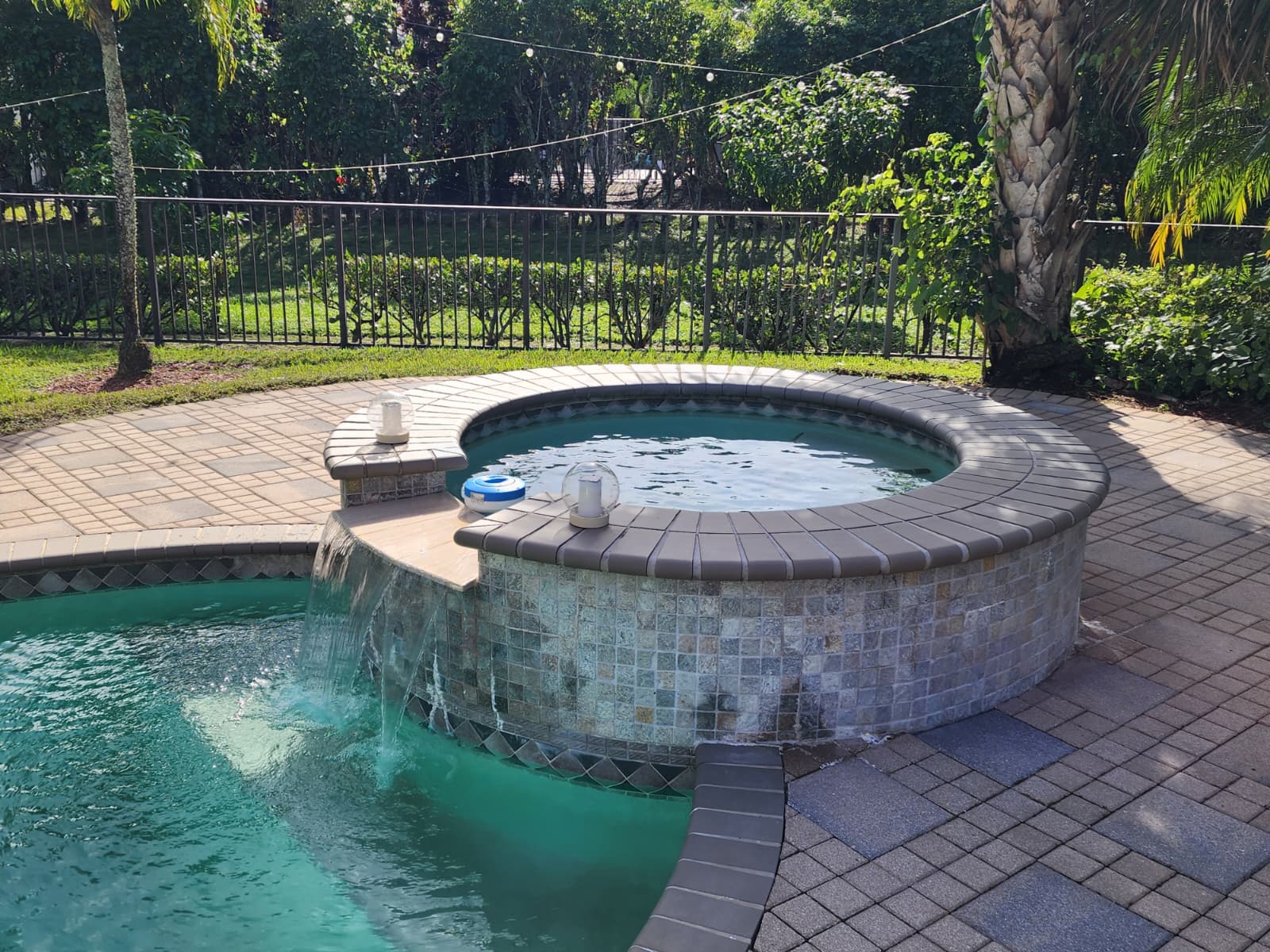Before power cleaning of pool deck in Boca Raton FL showing slippery algae, dirt buildup, and dark stains on concrete surface around residential swimming pool