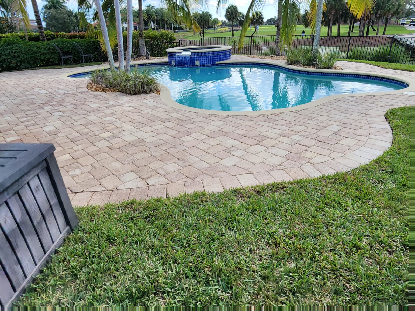 After power cleaning of pool deck in Boca Raton FL showing bright, restored concrete surface with algae, dirt, and stains completely removed