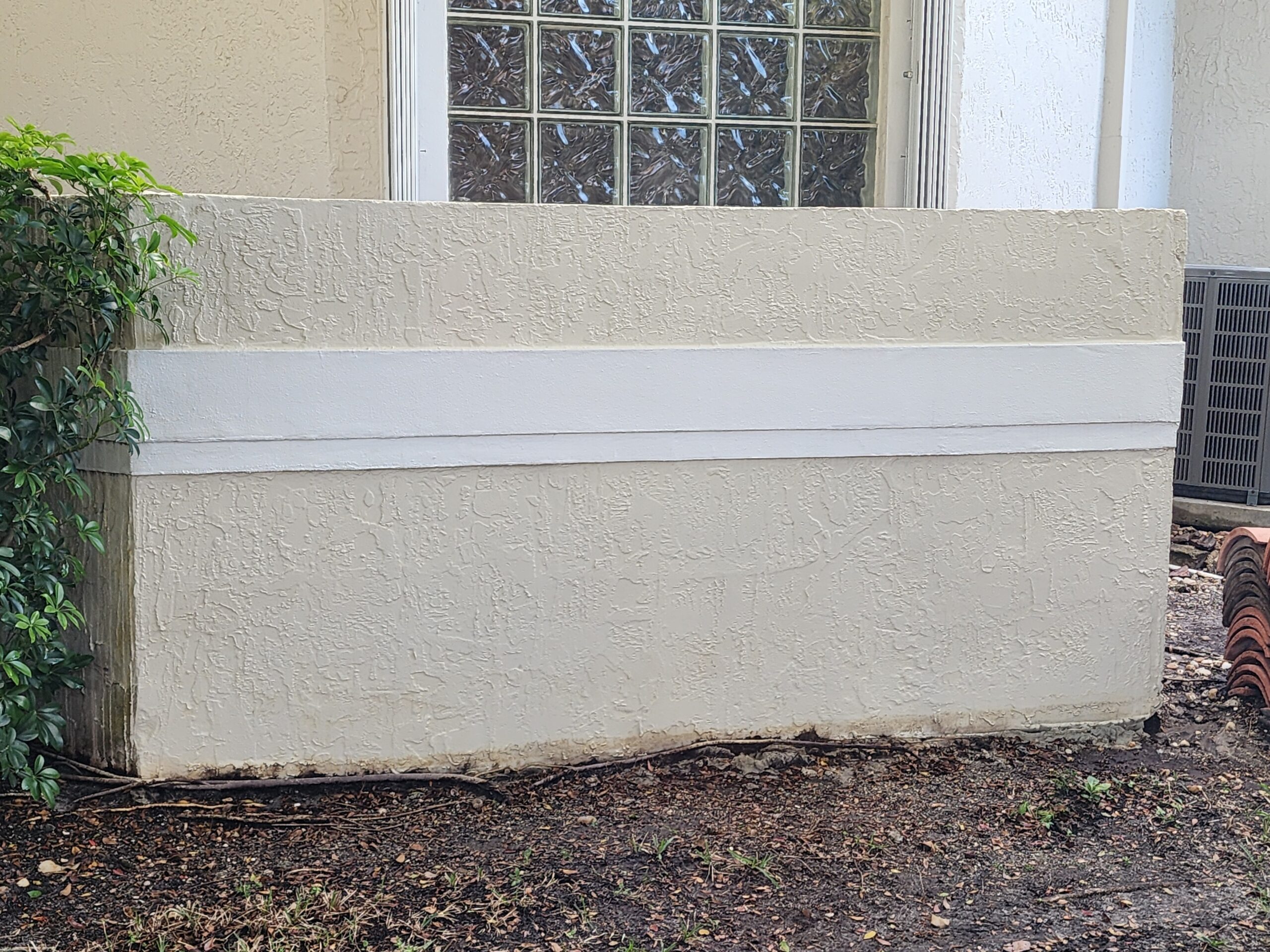 After power cleaning of exterior walls in Boca Raton FL showing clean, bright wall surfaces with dirt, algae, and stains safely removed